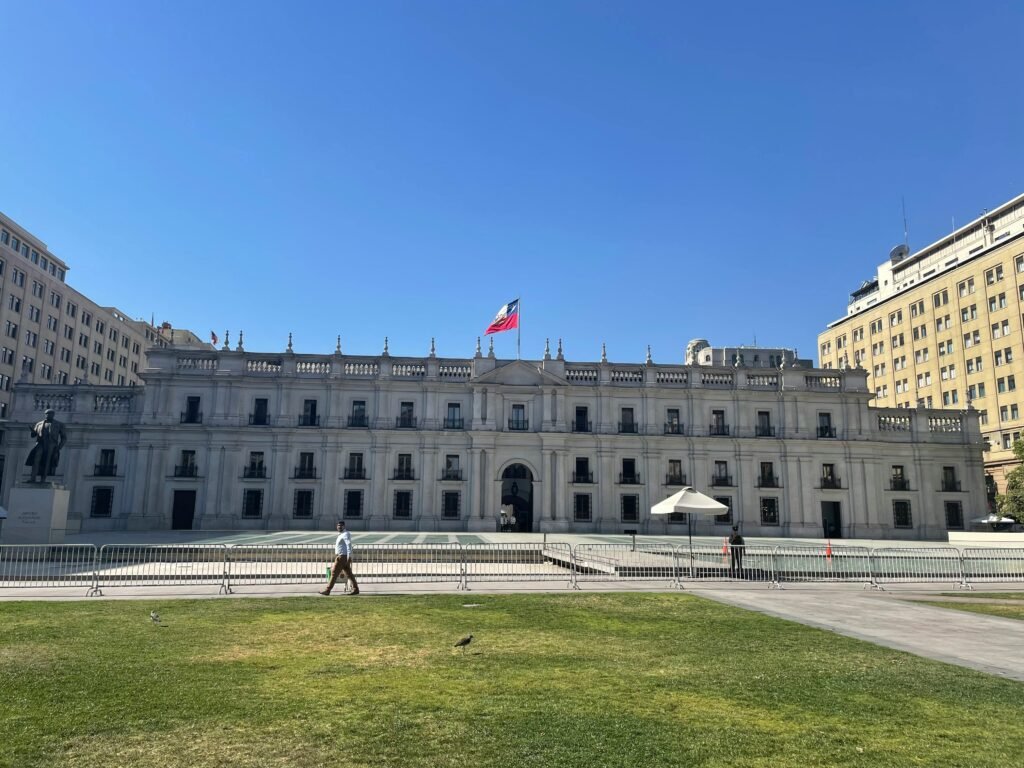 View of La Moneda Palace in Santiago, Chile on a sunny day.
